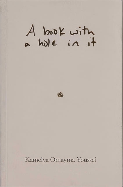 Book cover of: book with a hole in it. By: Kamelya Omayma Youssef